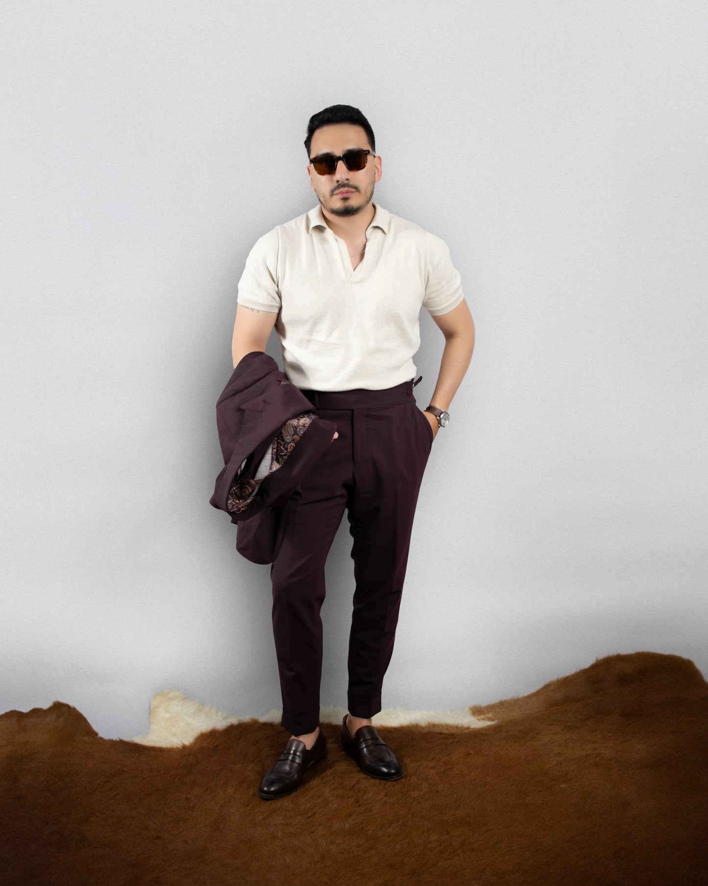 burgundy suit with a tan polo